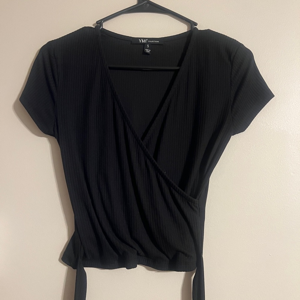 Small black cropped shirt.